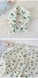 Detail of 100% cotton square scarf featuring fresh yellow floral and green leaf patterns