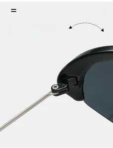 Macro detail of a durable metal hinge on sporty cat-eye sunglasses with cross screw