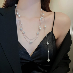 Detail of multi-layer baroque pearl long necklace showing high-end irregular pearl texture