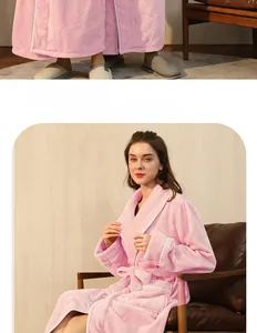 Detailed close-up of pink flannel bathrobe featuring white piping and soft texture