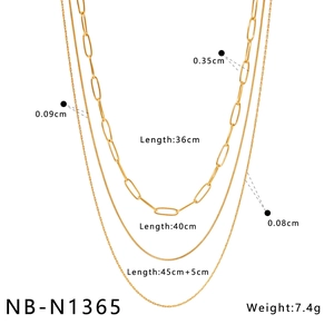 Detailed view of layered gold chain necklace lengths and width measurements on white background