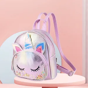 Iridescent unicorn backpack for girls with sequins and plush details on pink stand