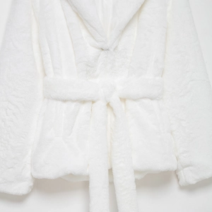 Chic white faux fur coat for women with matching waist belt in a modern loose fit