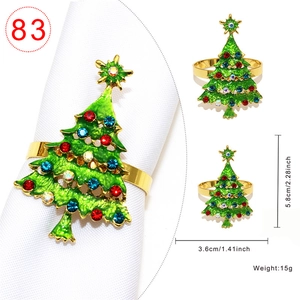Golden Christmas tree napkin ring with green enamel and sparkling colorful rhinestones