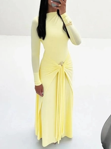 Slim fit pale yellow long sleeve maxi dress with waist pleats and silky texture