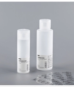 Set of 50ml and 100ml squeezable travel bottles with waterproof labels for toiletries