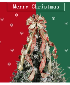 Detail of Christmas tree topper bow with vintage red truck print and festive patterns