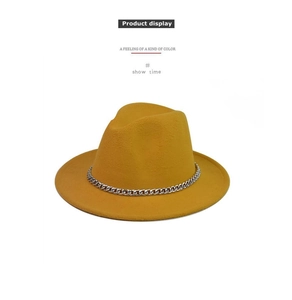 Close-up of yellow wool fedora hat featuring a polished silver metal chain band detail