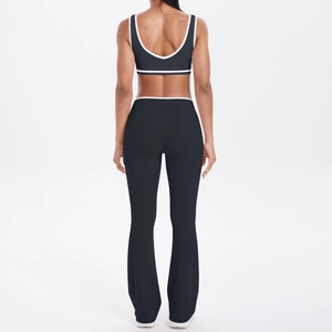 Detail view of the contrast trim on black sports bra and high-waist yoga flared pants