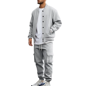 Detailed view of the striped rib-knit collar and button closure on grey baseball jacket