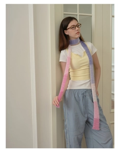Detailed texture of pink and purple gradient faux mink fur scarf on a stylish y2k outfit