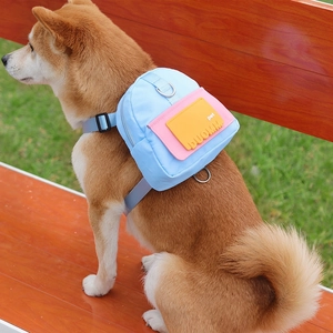 Blue dog backpack harness with adjustable straps and metal D-ring for small to medium pets