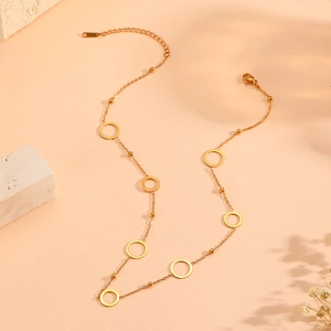 Elegant gold titanium steel necklace with small beads and hollow ring pendants