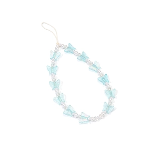 Detail of light blue butterfly beads and white pearls on a handcrafted phone wrist strap