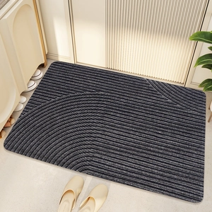 Detail of dark gray striped PVC door mat showing anti-slip texture and durable fiber