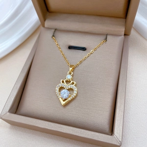 Elegant gold titanium crown heart pendant necklace with diamonds in a beige gift box