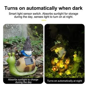 Solar powered garden gnome on snail statue with glowing flowers for outdoor decor