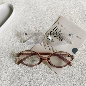 Fashionable oval clear frame anti-blue light glasses for women in a stylish setting