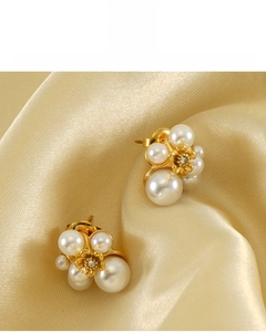 Macro detail of 18K gold plated floral pearl earrings featuring cluster design