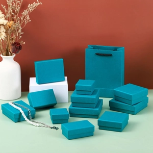 Set of indigo blue jewelry gift boxes and paper bags in various sizes for necklaces and rings