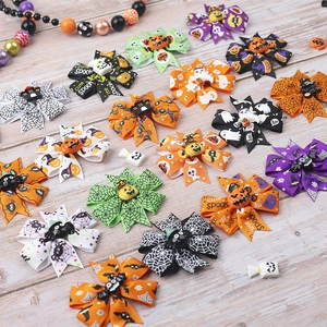 Halloween triple-layer dovetail hair bows with pumpkins and ghosts on wood background