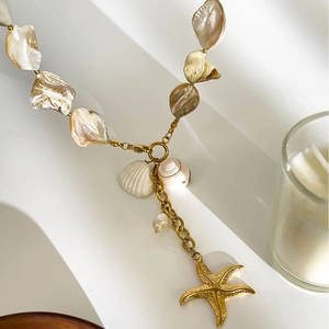 Starfish and shell pendant necklace in gold-plated steel with natural marine elements
