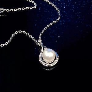 Baroque style faux pearl pendant necklace with silver chain and cubic zirconia accents