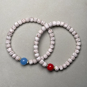 Detail of Xingyue Bodhi beads with blue agate accent and decorative metal spacers