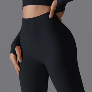 Close-up of high waist ribbed compression leggings and long sleeve top with thumb holes
