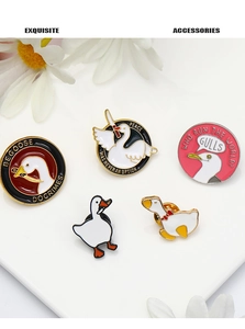 Macro shot of 5 funny enamel goose and seagull pins with Peace was never an option text