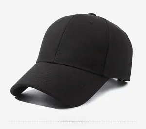 Side view of black cotton baseball cap with brown ELEVEN letter embroidery and curved brim