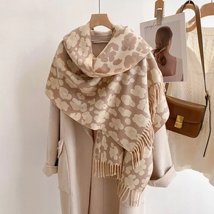 Classic leopard print cashmere-feel scarf in beige and brown with elegant fringe details