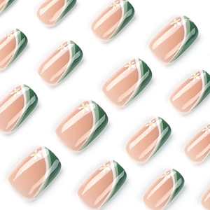 Short square press-on nails with green and white French wave patterns and floral design
