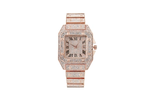 Detail of rose gold square watch with full diamond setting and Roman numerals