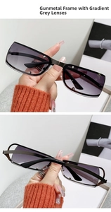 Detail of gunmetal oval sunglasses with grey gradient lenses and stylish decorative rivets