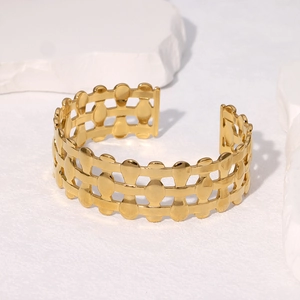 Elegant gold-plated stainless steel hollow cuff bracelet with woven teardrop pattern design