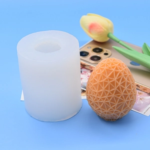 Detail of white silicone mold for DIY candles with textured geometric egg finish
