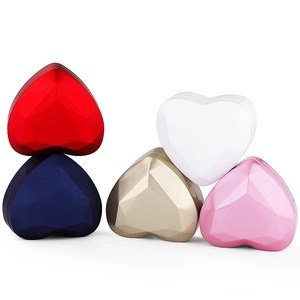 Heart-shaped LED ring boxes in five colors with geometric facets on white background