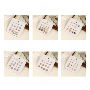 Detail view of 6-piece stainless steel stud earring sets with pearls and floral designs