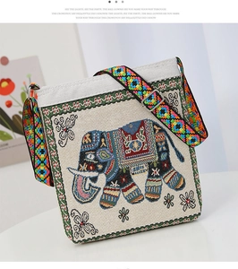 Close-up of elephant embroidery and colorful woven shoulder strap on canvas bag