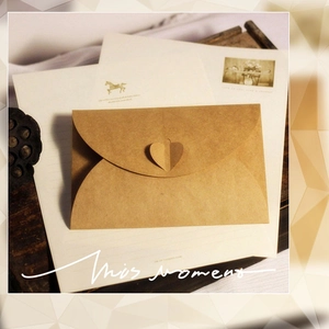 Vintage brown kraft paper envelope with heart-shaped closure and matching lined paper set