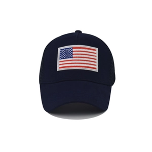 Detail of USA flag embroidery on navy mesh trucker hat with premium stitching