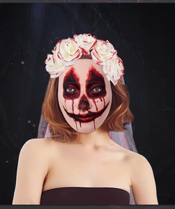 Detail of bloody clown mask with rose headband and gray veil for Halloween costume