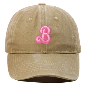 Close-up of pink embroidered B letter on a khaki washed cotton baseball cap texture