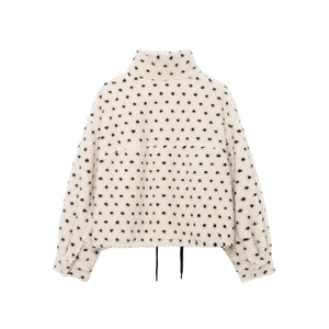 Veste en polaire crème à pois noirs avec col montant et poignets élastiques