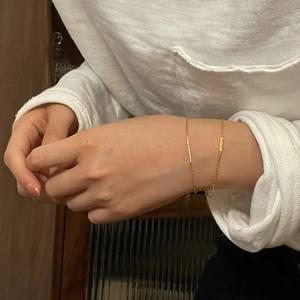 Minimalist gold link bracelet with a polished rectangle charm for women elegant style