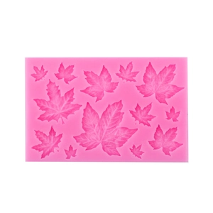 Pink rectangular silicone mold with 10 maple leaf cavities for cake decoration
