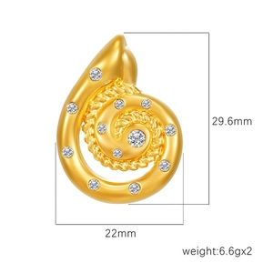 Golden spiral shell earrings with white zircon accents in a minimalist vintage style