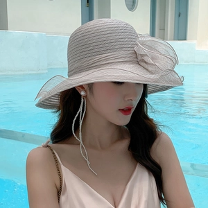 Women's wide brim organza flower straw sun hat in khaki with elegant pearl earrings