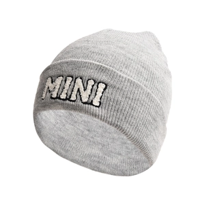 Detail showing grey knit beanie with white MINI letter embroidery on a white background